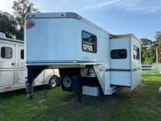 (AVAILABLE AFTER FEB 1ST 2022) 2007 Sundowner (3) horse living quarter with a 10’ conversion that has a Slide Out with couch, A/C unit, furnace, stereo system, sink, microwave, 6cu fridge & freezer, lots of cabinets, large closet space and a nice bathroom.  In the bathroom you have a toilet, shower, sink with medicine cabinet, linen closet and a walk thru door into the horse compartment.  