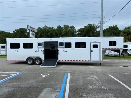 2022 Jamco (6) horse head to head trailer with a 4' tack room that has bridle hooks.  The horse compartment has an interior height at 8' tall x 8' wide, escape door with a drop down window, insulated roof, roof vents, makes into (3) box stalls, air flow center gates, side ramp with dutch doors, removable dividers,  and a rear ramp with dutch doors.  The exterior has a hydraulic jack, aluminum wheels and a spare tire.   