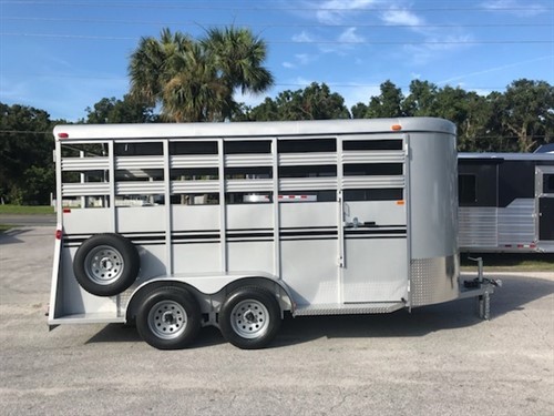 (On Order) 2022 Bee 16' stock bumper pull trailer with an interior height at 7' tall x 6' wide x 16' long, escape door, full swinging center gate, rubber mat over wood floor and a full swinging rear door with a half slider.  The exterior has two 3500lbs axles, spare tire and weighs 2350lbs.   