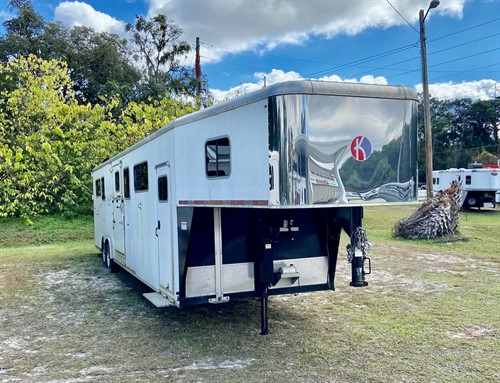 (SALE PENDING) 2017 Kiefer (6) horse head to head trailer with a front tack room with bridle hooks.  The horse area has an interior height at 8' tall x 8' wide, escape door, insulated roof, makes (3) box stalls, side ramp with dutch doors, rumber flooring and a rear ramp with dutch doors.  The exterior has electric over hydraulic brakes, hydraulic jack and a spare tire. 
