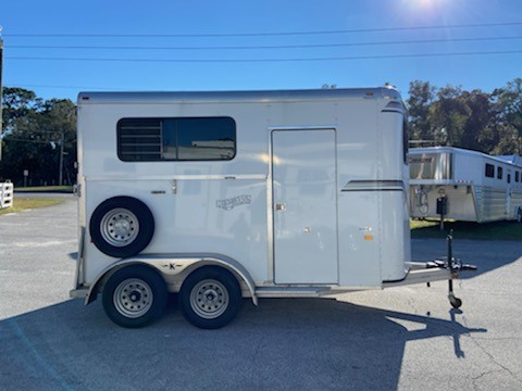 2018 Kingston (2) horse straight load bumper pull trailer with an interior height at 7’6” tall x 7’ wide, two escape doors, roof vents, sliding bus windows throughout, removable divider, rubber mats over all aluminum floor and a rear ramp with dutch doors!  Spare tire.  