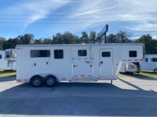 2014 Kiefer (2+1) Trailer with a 4’ tack room that has saddle racks, bridle hooks, walk thru door into the horse area and a brush box.  The horse area has an interior height of 7’6” tall x 7’ 2” wide, escape door, drop down windows, roof vents, air flow center gates, removable divider, rubber mat over all aluminum floor, side ramp with dutch doors and a rear ramp with dutch doors.  Spare tire. 