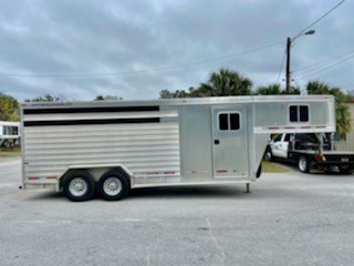 2008 Featherlite (3) horse slant load stock combo living quarter trailer with a fully contained 8’ conversion that has an a/c unit, microwave, electric fridge, cabinets, closet, desk area and a toilet shower combo.  The horse area is 7’ tall x 7’ wide, stock sided, rubber mats over all aluminum floor and a full swinging rear door with a half slider.   Manual jack, propane tanks and spare tire.   