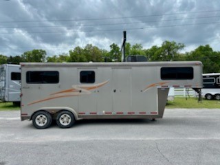  2010 Hawk (2) horse straight load weekender trailer with an 8’ conversion that has an A/C unit, cabinets, closets, sink, microwave, (2) wooden saddle racks, couch and a walk thru door into the horse area.  In the horse compartment you have an interior height at 7’6” tall x 7’ wide, (2) escape doors, roof vents, rubber lined walls, removable divider and a rear ramp with dutch doors.  The exterior of this trailer has a manual jack, weighs 4881lbs, GVWR is 10,400lbs.   