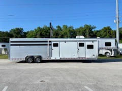 2022 Kiefer 14’ Stock Living Quarter Trailer with a 10’ LSR Conversion that has an A/C unit, furnace, dinette, microwave, sink, cooktop, 6cu fridge & freezer, closet, cabinets, T.V. and stereo system.   The bathroom has a toilet, radius shower, sink with medicine cabinet, linen closet and a walk thru door into the Midtack.  