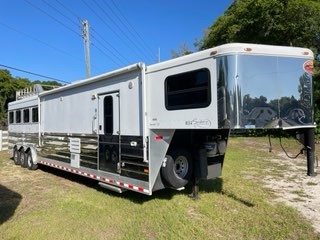 2011 Sundowner 8014 (4) horse living quarter trailer with a 14’ Signature Series Conversion that has an A/C unit, furnace, couch, corner chair, convection oven, 6cu fridge & freezer, cooktop, sink, cabinets, T.V., stereo system, and large closets.  In the bathroom you have a radius shower, sink with medicine cabinets, linen closet and a walk thru door into the horse area. 
